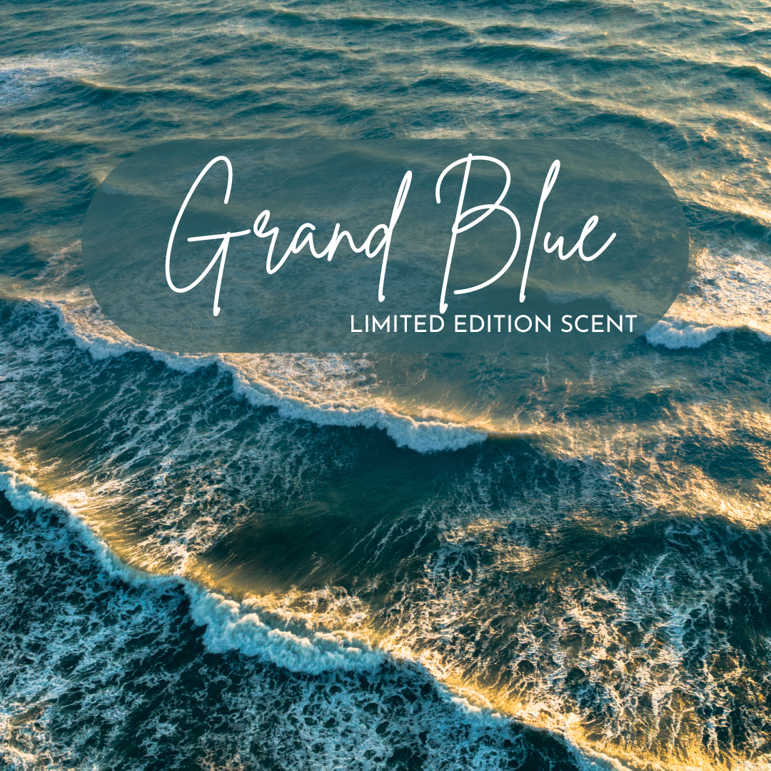 Waves crash and ripple under golden sunlight in this ocean-inspired image used to promote the limited edition Grand Blue scent, evoking fresh, coastal energy and sea spray.