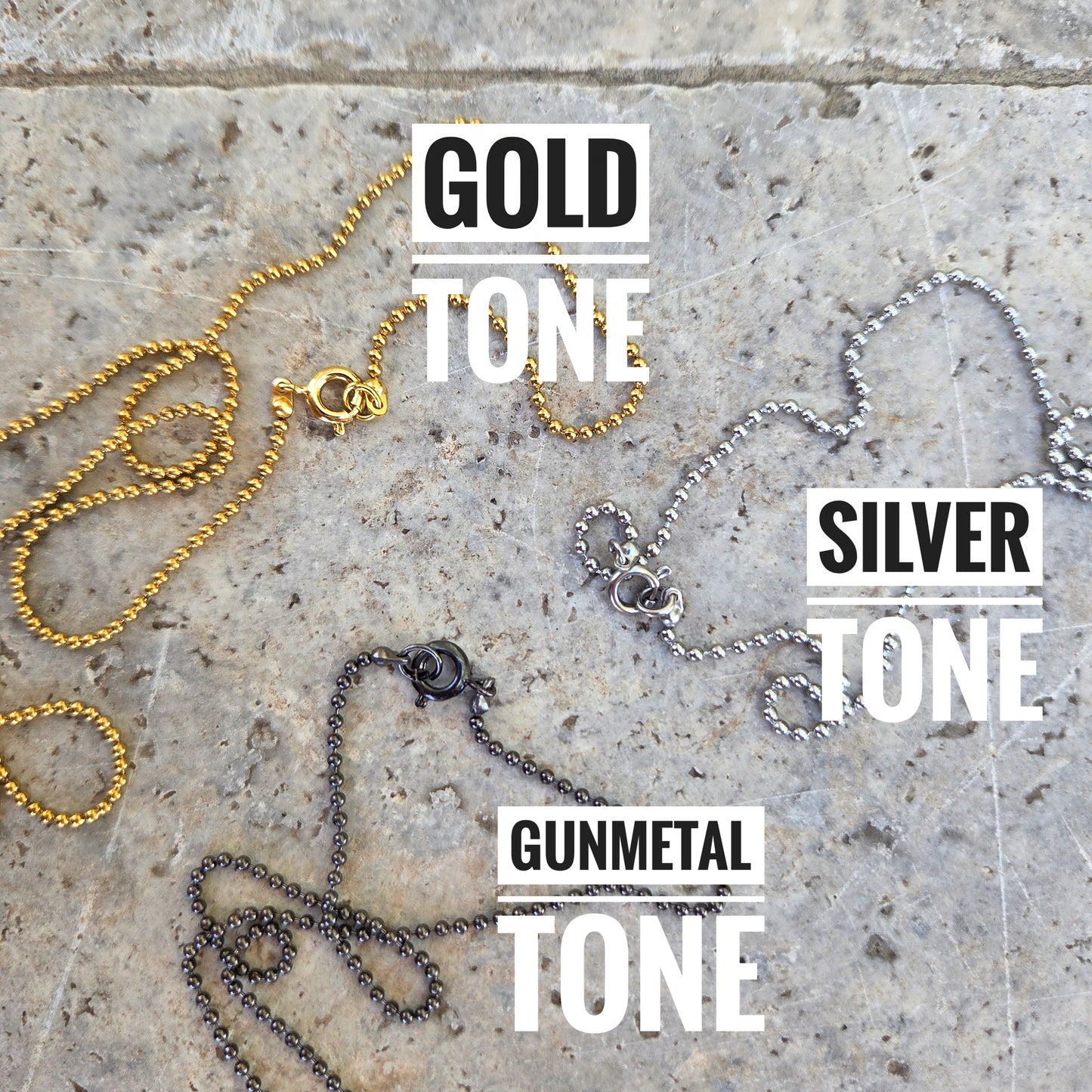 Gold-tone, silver-tone and gunmetal ball chain options for reclaimed glass initial necklaces.