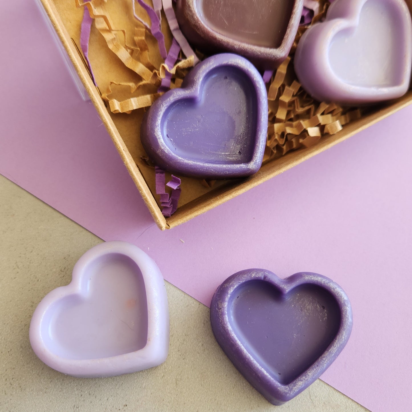 Wax hearts in various shades of purple.