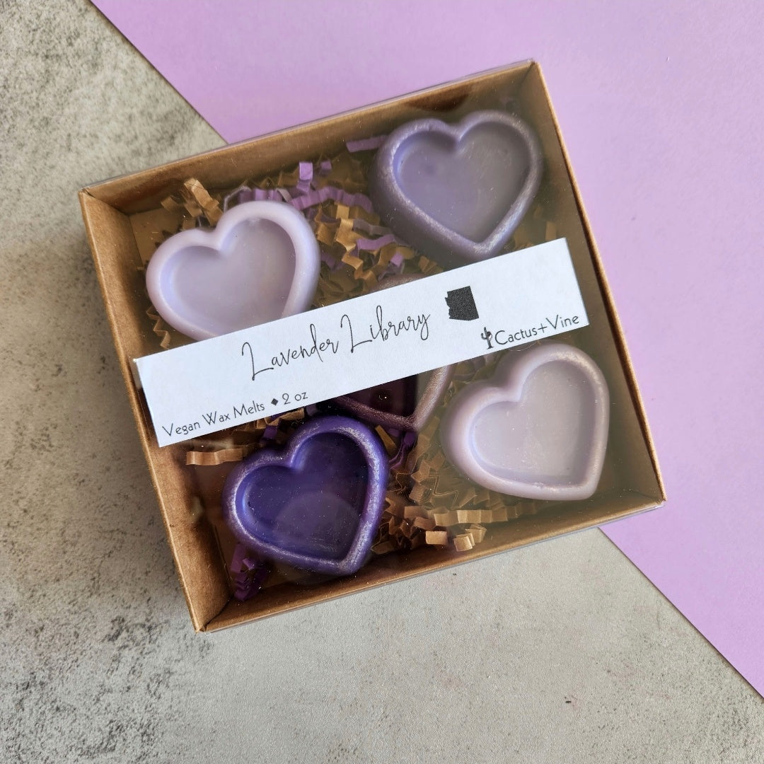 Box of Lavender Library wax melts, showcasing heart-shaped soy wax melts in various shades of purple, complete with a branded label for Cactus Vine.