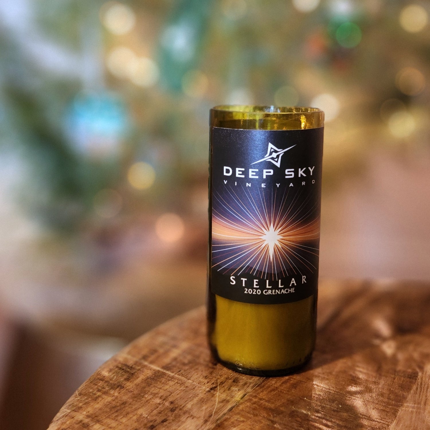 This candle, beautifully crafted in a recycled Deep Sky Vineyard bottle, shines as a radiant addition to any space. Its sleek design is perfect for elevating your decor or gifting to someone special.