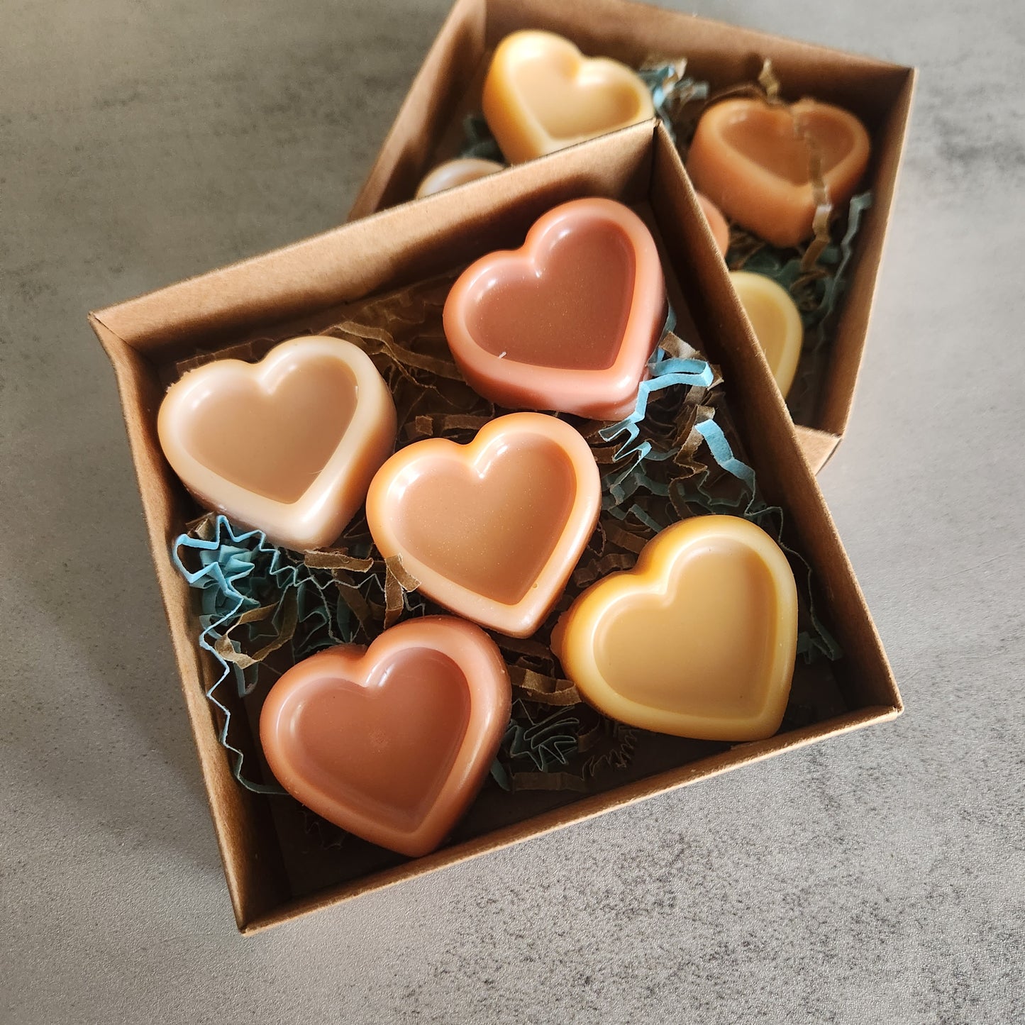 Two boxes of Sonoran Rain heart-shaped wax melts displayed on a neutral background, emphasizing their Arizona-inspired design.