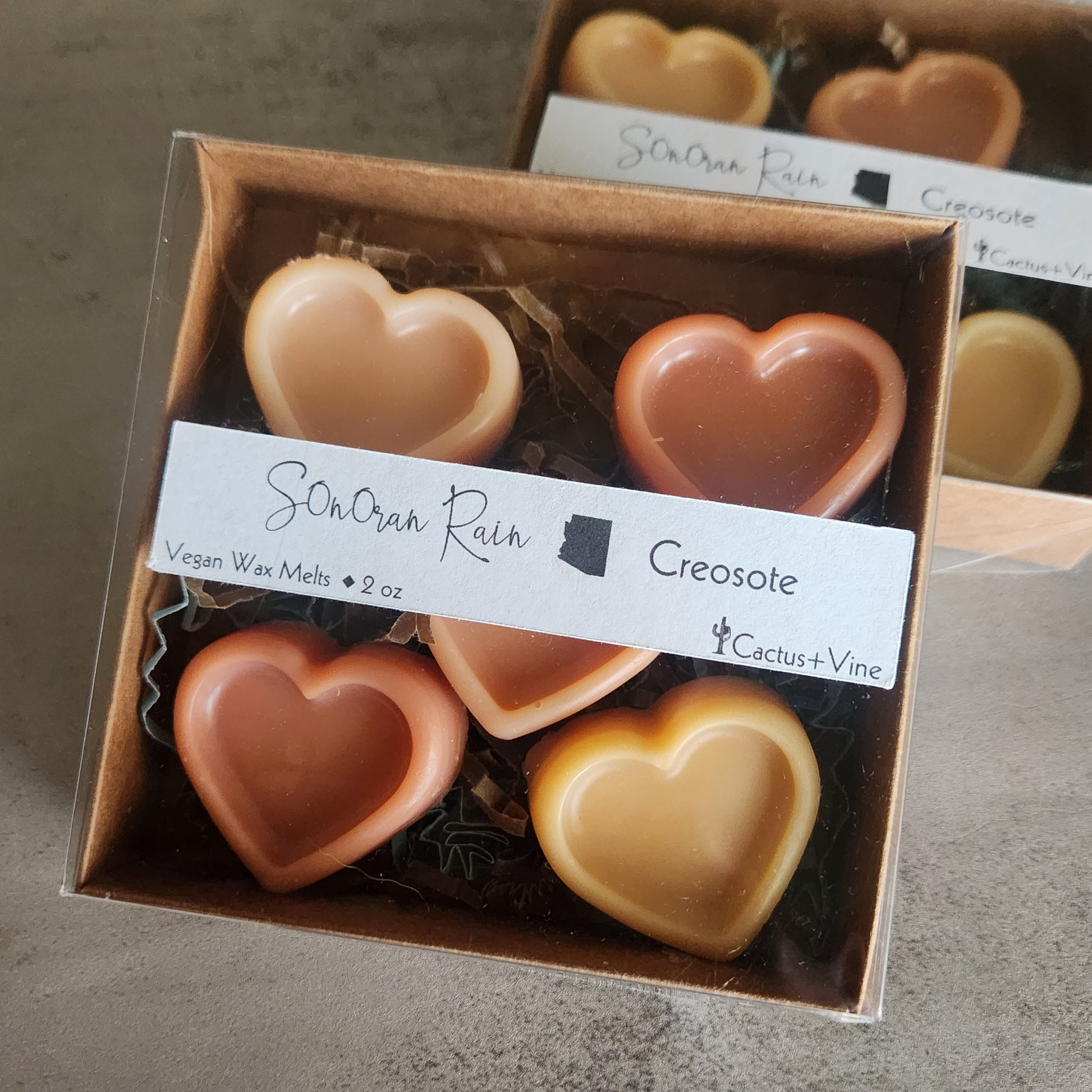 Sonoran Rain wax melts packaging showcasing the vegan, eco-friendly label and heart-shaped wax melts.