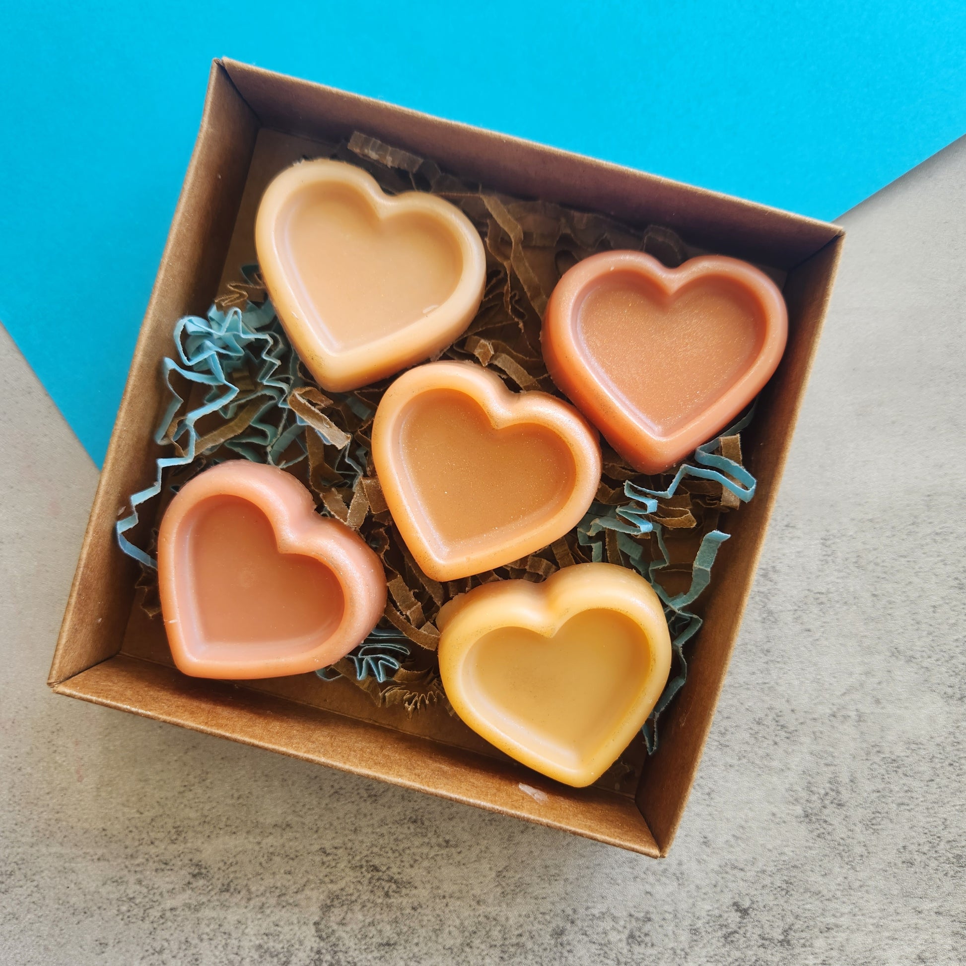 Open box of Sonoran Rain wax melts, displaying the heart shapes and unique scent profile inspired by Arizona’s desert rain.