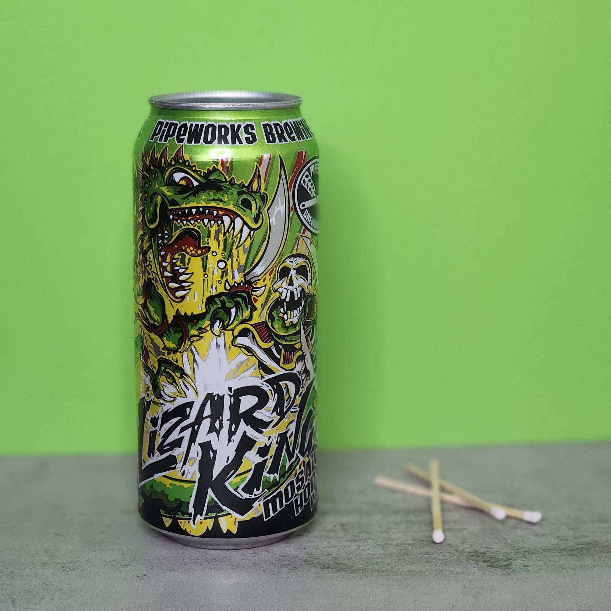 Bourbon Lime scented candle in a recycled Lizard King beer can from Pipeworks Brewing, featuring a bold, colorful design with a roaring lizard and skull imagery, perfect for adding a unique decorative touch to your home