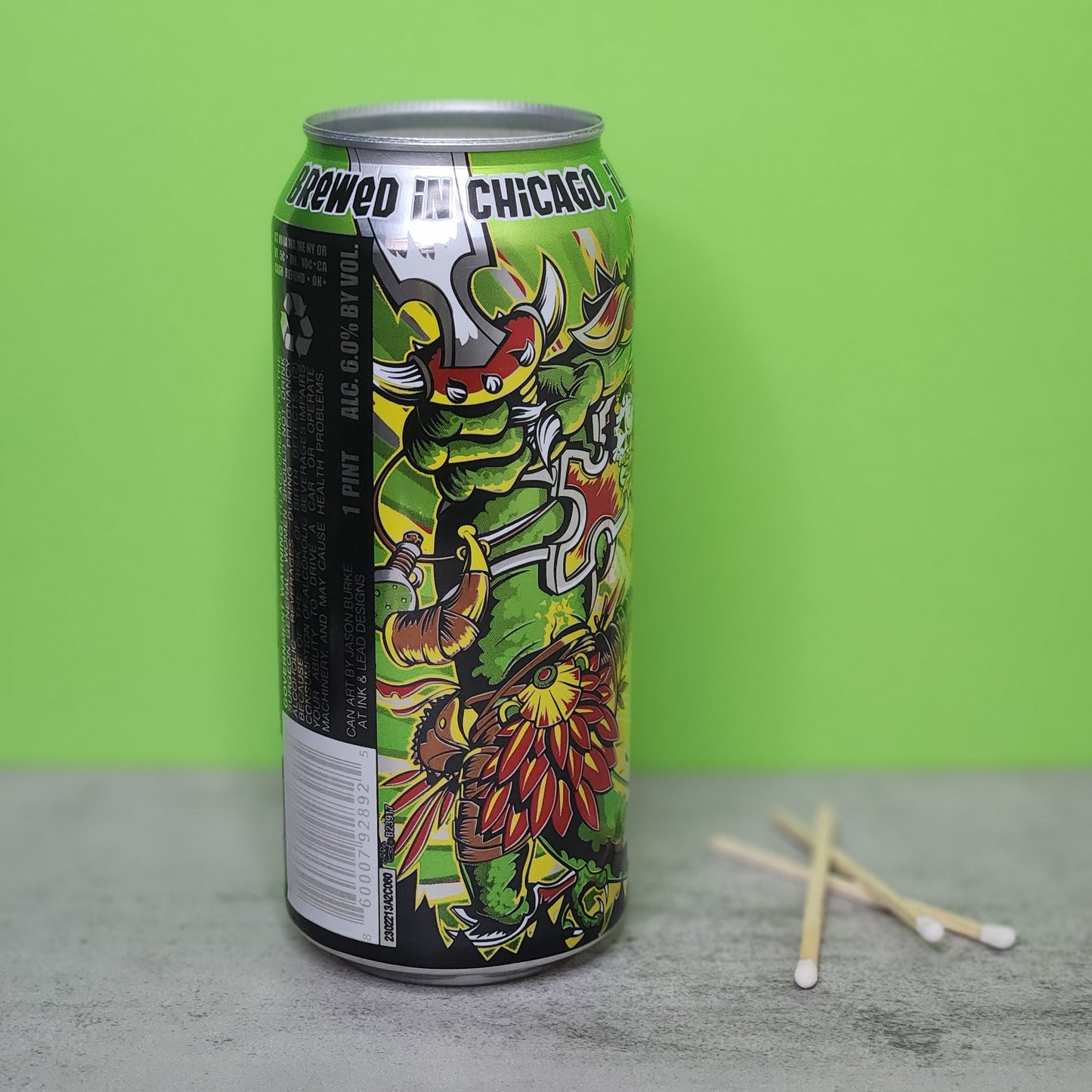 Back view of a Bourbon Lime scented candle housed in a recycled Lizard King beer can, highlighting the detailed design and eco-friendly materials, making a bold statement in any room.