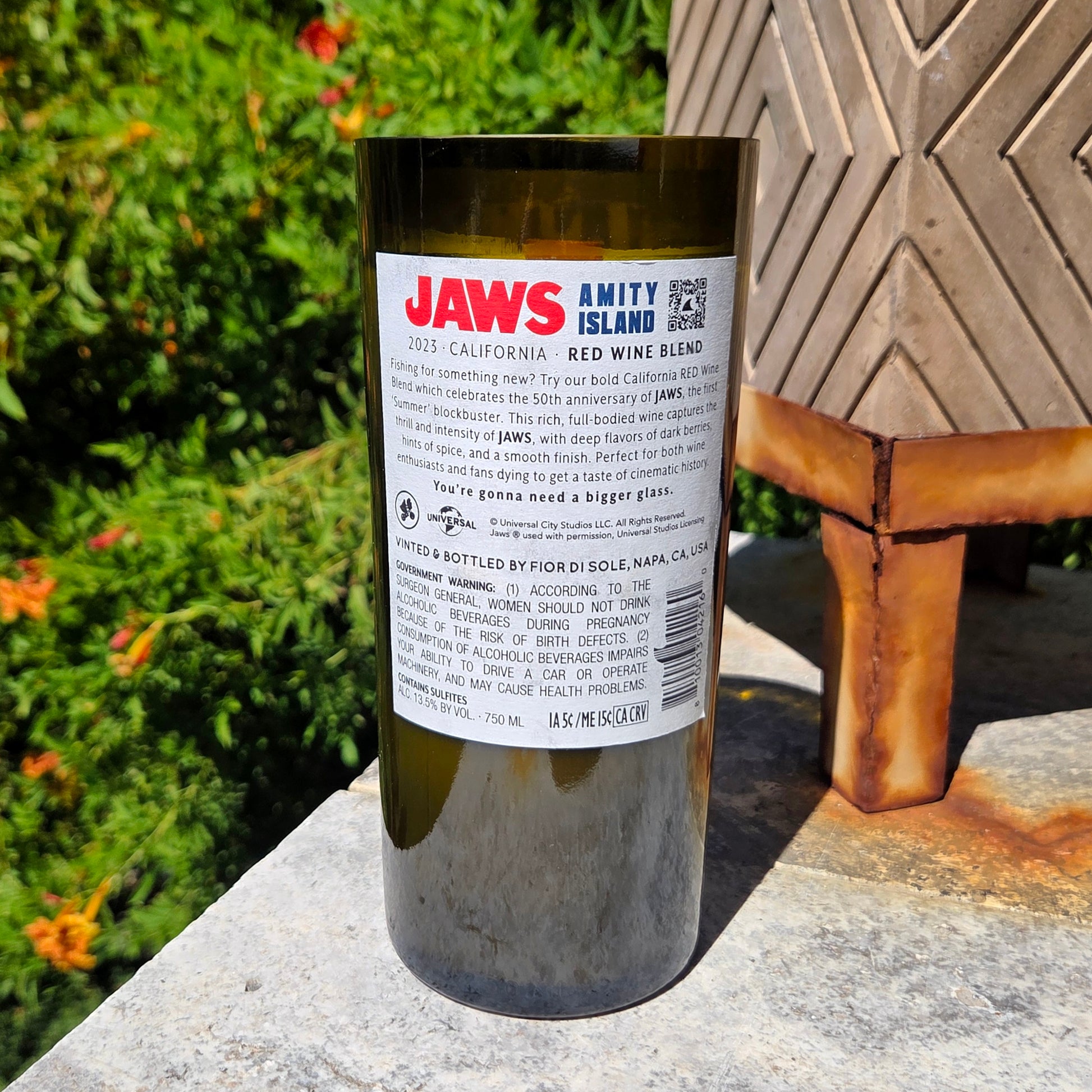 Back label of Jaws Amity Island Red inspired wine bottle candle, repurposed into an eco-friendly coconut soy candle with wooden wick for clean burning.