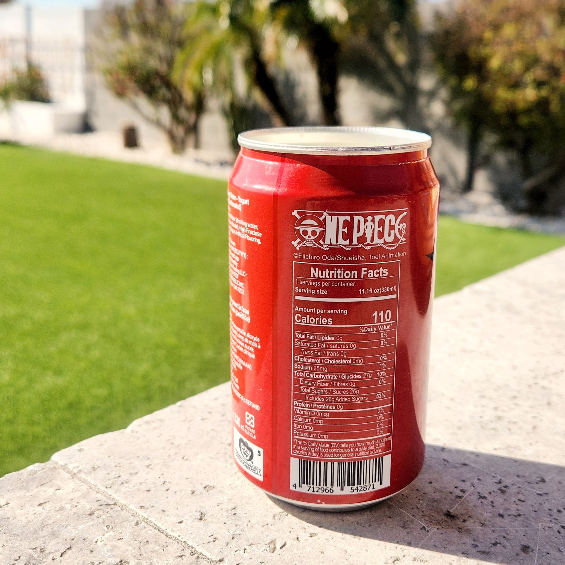 Back view of an upcycled soda can candle featuring a recognizable pirate-themed label. The image showcases the candle's recycled aluminum vessel, emphasizing its sustainable and handmade appeal.