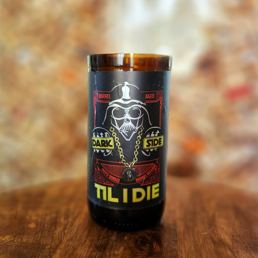 A recycled beer bottle candle with a bold, Star Wars-inspired design, featuring the same “Dark Side Til I Die” graphic. Made with coconut soy wax and a crackling wooden wick for a clean, long-lasting burn.

