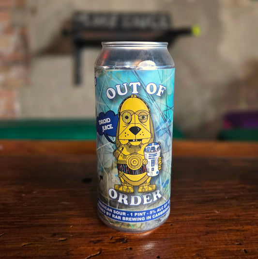 A detailed look at a single beer can candle with a blue label and "Droid Juice" text, repurposed from a RaR Brewing can and filled with eco-friendly coconut soy wax and a wooden wick inside.