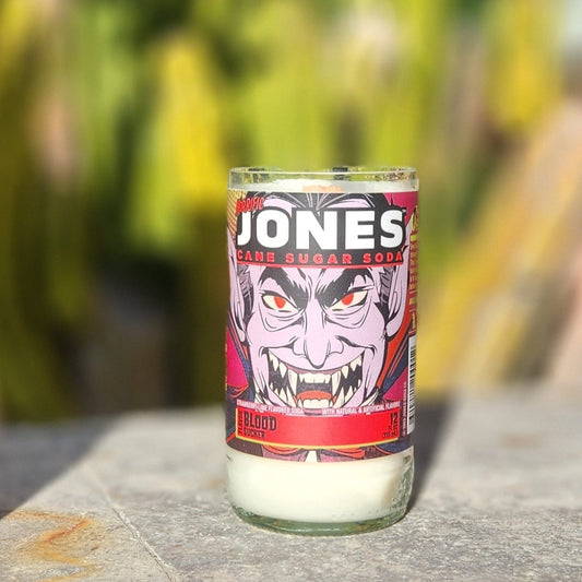 Unleash spooky vibes with this hand-poured candle in a recycled Jones Soda can. Featuring the bold Vampire design, it’s a perfect mix of Halloween fun and eco-conscious style