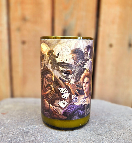 Front-facing view of a wine bottle candle made from a recycled green glass bottle, wrapped in detailed Western saloon shootout artwork. Hand-poured with coconut soy wax and a wooden wick for a unique, sustainable home accent.