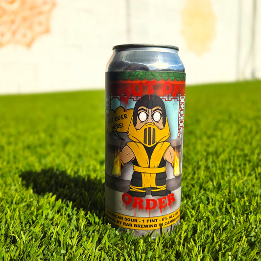 Upcycled beer can candle featuring a Mortal Kombat-inspired Scorpion cartoon dog design, standing on vibrant green grass. The label shows the character in a yellow ninja outfit with flaming hands and a speech bubble saying “Get Over Here!” This hand-poured coconut soy wax candle with a wooden wick blends bold pop culture art with sustainable, eco-friendly home décor.