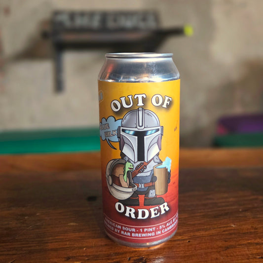 A hand-poured beer can candle made from a recycled "Out of Order" sour ale can featuring a Mandalorian-inspired character holding a mug of blue milk, with a baby alien companion in a floating pod. This eco-friendly wooden wick candle brings a playful, galactic vibe to your space—perfect for Star Wars fans and collectors.