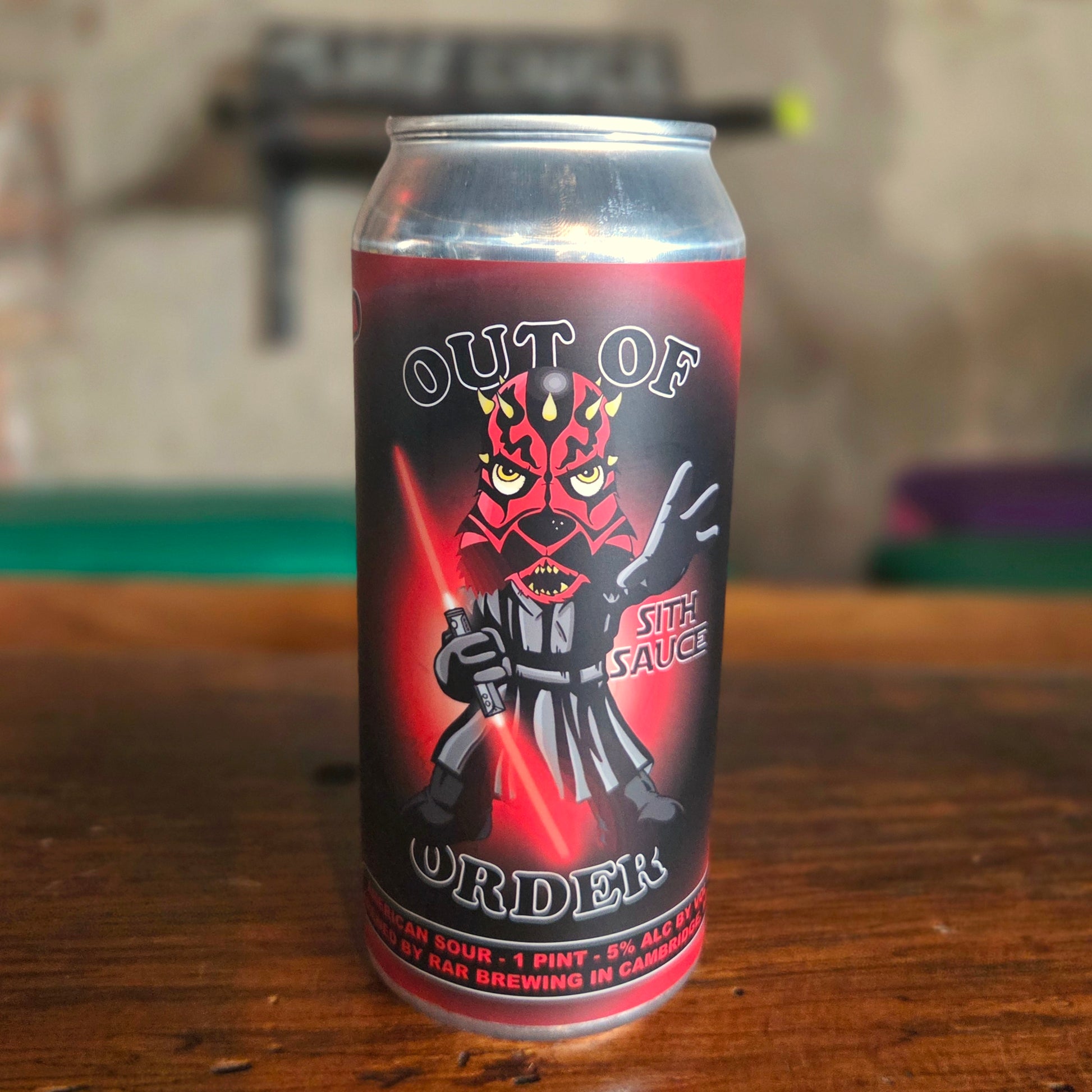 An upcycled beer can candle crafted from a "Sith Sauce" can by RAR Brewing, featuring bold red and black artwork of a Sith-inspired character wielding red lightsabers. This clean-burning, coconut soy candle adds dramatic flair and dark side energy to any fan’s collection.