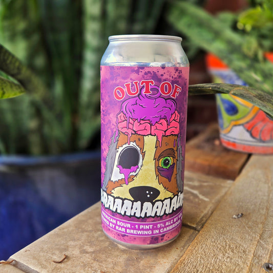 Angled shot of a beer can candle with a vivid purple “Out of BRAAAAAAAAins” label featuring a cartoon dog with an exposed pink brain, torn eye, and oozing details. This unique upcycled candle is hand-poured using coconut soy wax and a crackling wooden wick.