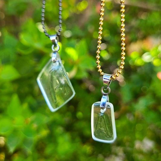 Two Letter A initial necklaces made from recycled bottle glass with original raised lettering