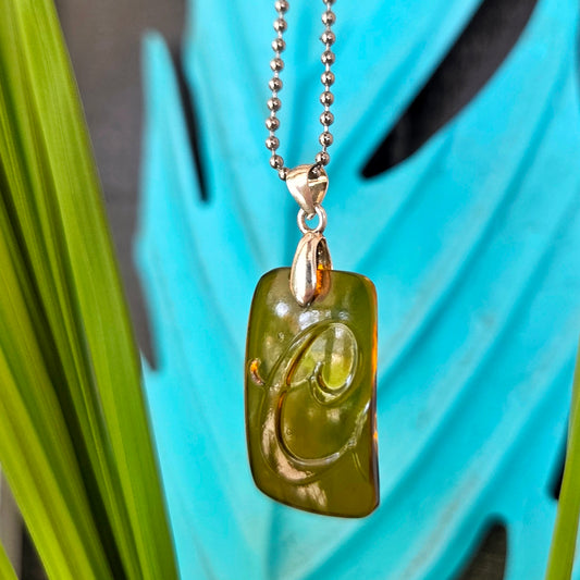 Letter C initial necklace made from recycled Coors beer bottle glass with original raised lettering