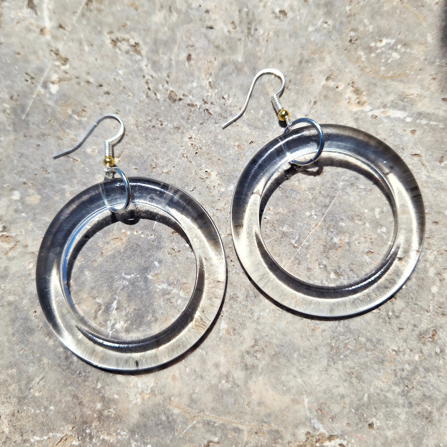 Oversized clear upcycled bottle glass hoop earrings with silver-tone earwires and gold-tone bead accents