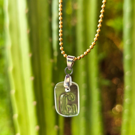 Letter G initial necklace made from clear recycled wine bottle glass with original raised lettering
