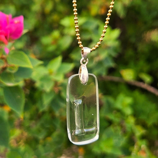 Letter L initial necklace made from clear recycled bottle glass with original raised lettering