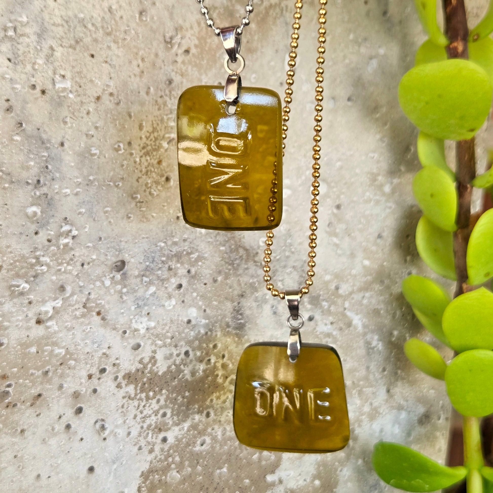 Two ONE necklaces made from recycled wine bottle glass with original raised lettering in vertical and horizontal styles