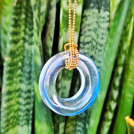 Large pale blue glass ring necklace handcrafted from a recycled gin bottle neck