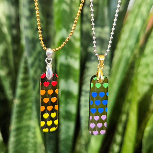Set of two BFF heart necklaces handmade from recycled Prosecco bottle glass with colorful heart patterns