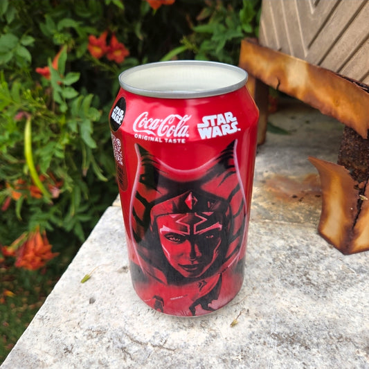 Handmade recycled Coke can candle featuring a red sci-fi character design, filled with coconut soy wax and Private Reserve fragrance.