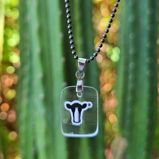 Recycled Danzeisen Dairy milk bottle glass necklace with original black cow design from an Arizona dairy bottle