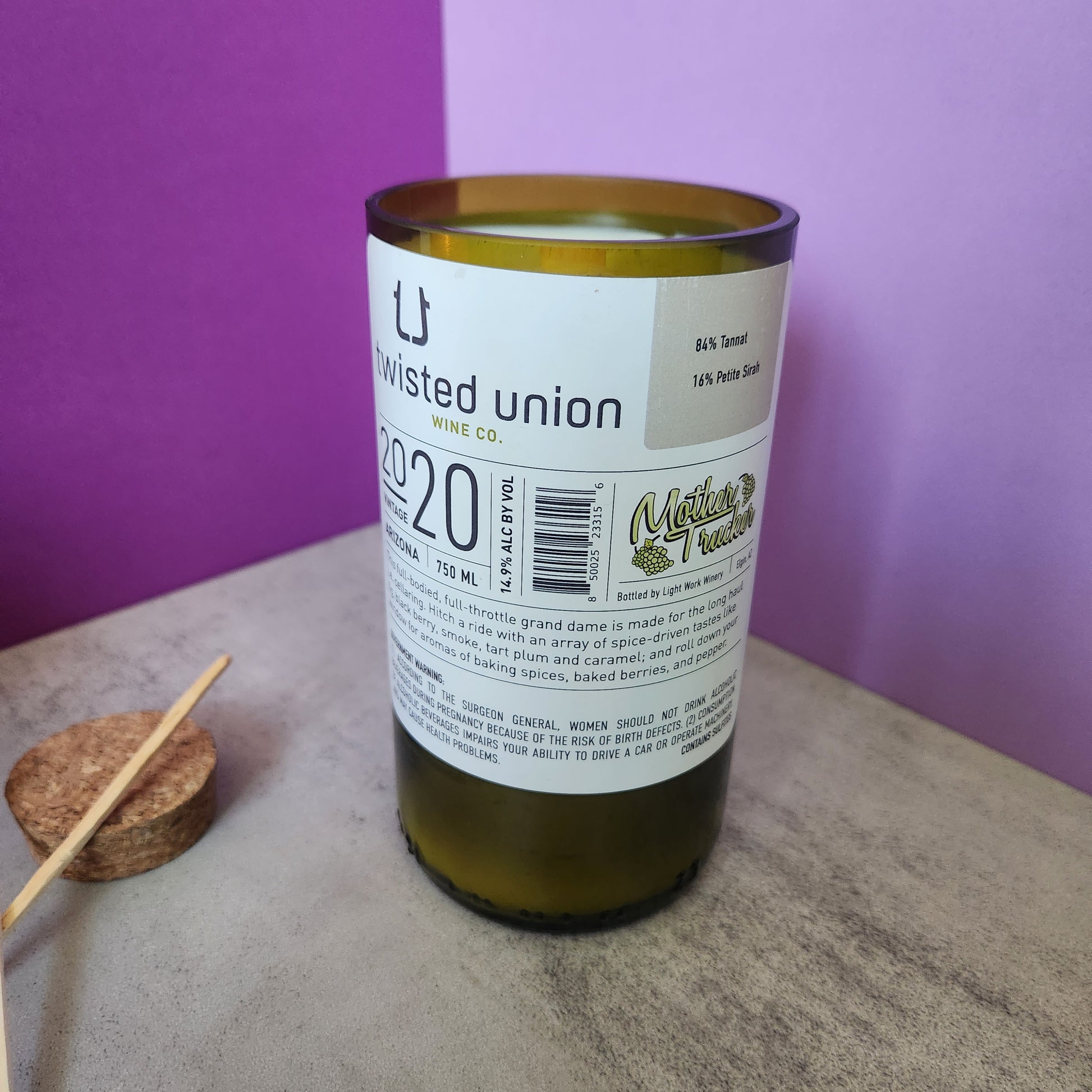 Back view of the Sage & Lavender scented candle in a recycled wine bottle, showing the label details and wine ingredients.