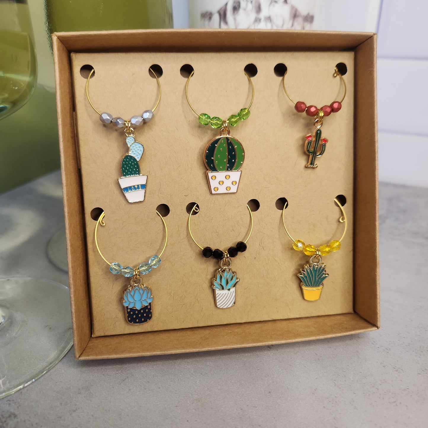 Cactus and succulent wine glass charms displayed in a gift box, ideal for parties and a thoughtful gift for wine lovers.