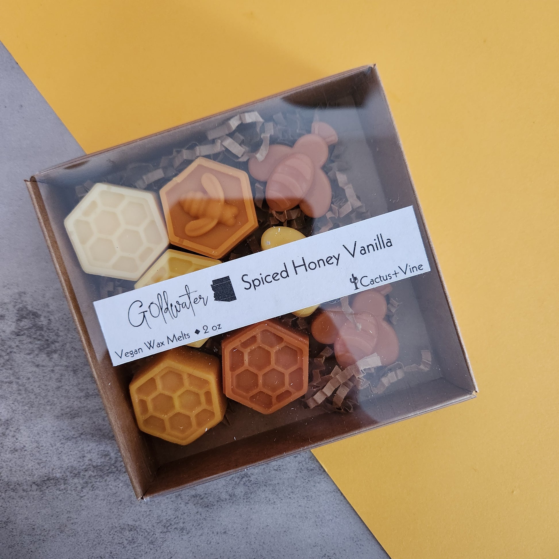 Goldwater Spiced Honey Vanilla wax melts packaging showing a clear lid with a label, highlighting the vegan wax tarts from Cactus Vine.