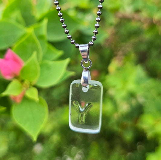 Letter Y initial necklace made from clear recycled whiskey bottle glass with original raised lettering